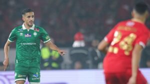 Moroccan football player on the field during a match - Bladna News Morocco.