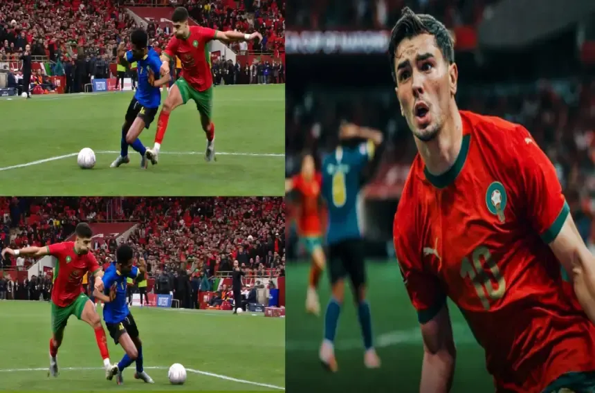 Morocco's player in red battles for the ball against a blue-clad opponent, showcasing intense match action amid a vibrant stadium crowd.