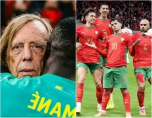 Moroccan football coach embraces a player, alongside a group of celebrating Moroccan players in their iconic red and green kits.