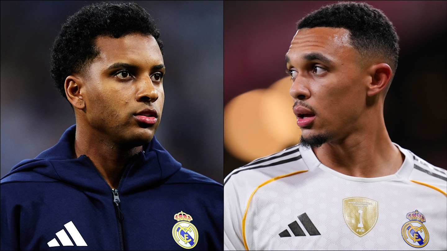 Rodrygo dans un survêtement du Real Madrid et Trent Alexander-Arnold dans un kit de couleur claire, tous deux plongés dans leurs pensées.