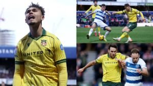 Wrexham-spelers in geel vieren een doelpunt, terwijl actie plaatsvindt met spelers in blauw en wit tijdens een competitieve wedstrijd.