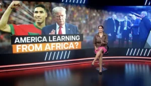 Achraf Hakimi celebrates in Morocco kit alongside Donald Trump, with a presenter discussing themes of learning from Africa, set against a vibrant backdrop.