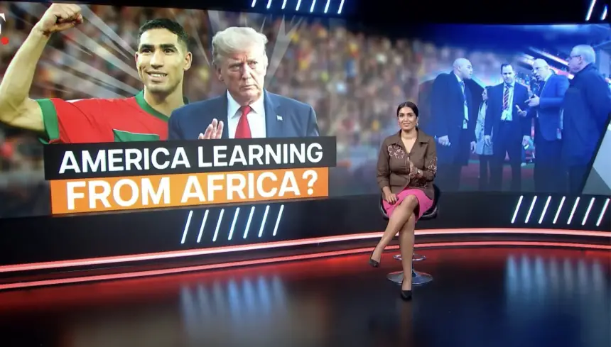 Achraf Hakimi celebrates in Morocco kit alongside Donald Trump, with a presenter discussing themes of learning from Africa, set against a vibrant backdrop.