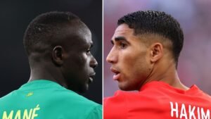 Sadio Mané in a green shirt, facing left, and Achraf Hakimi in a red shirt, facing right, highlight the rivalry between Senegal and Morocco.