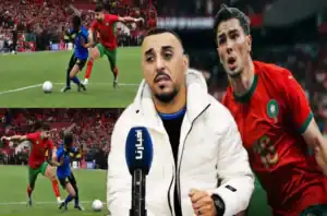 Moroccan players in action during a match, featuring a player in a red kit, with an analyst speaking in front of a stadium backdrop.