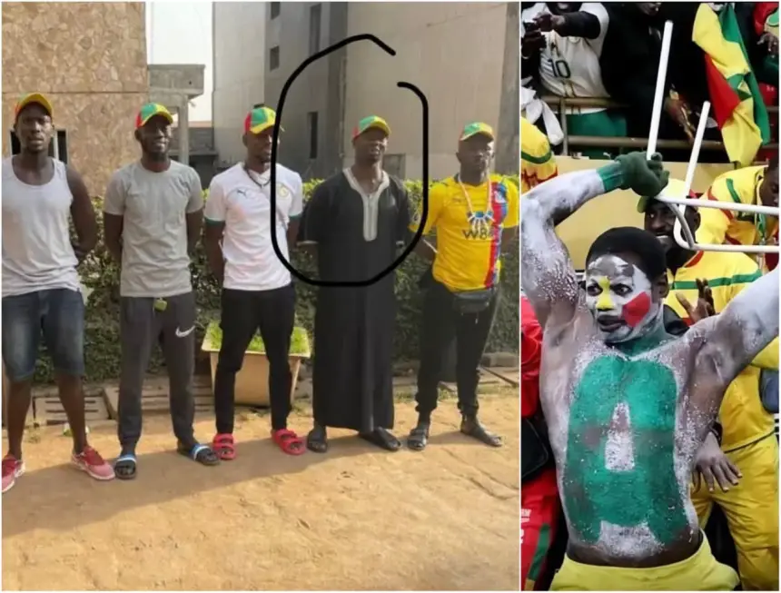 Un groupe de supporters du Sénégal, portant les couleurs de l'équipe et des casquettes. Un fan est vêtu d'un habit traditionnel, tandis qu'un autre a le visage peint.
