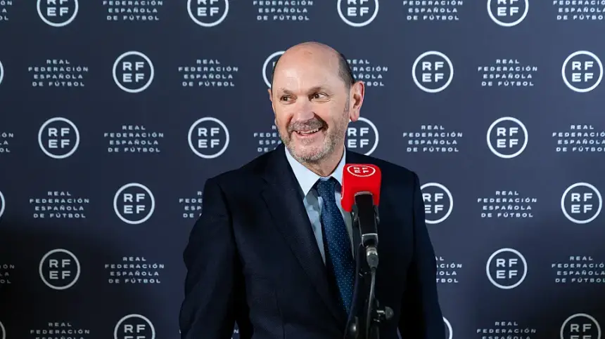 Luis Rubiales smiles during a press conference at the Real Federación Española de Fútbol, highlighting his role in Spanish football.