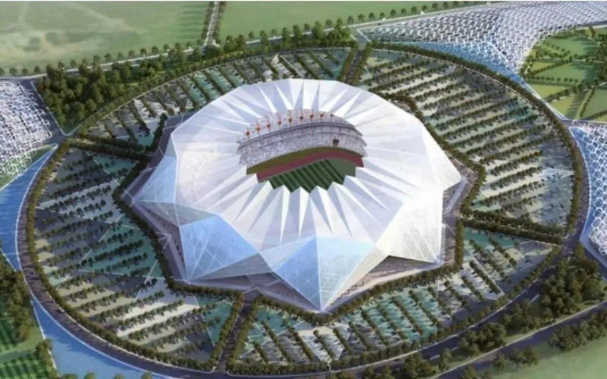 Futuristic stadium design surrounded by greenery, featuring a distinctive pointed roof, set for the 2030 World Cup final between Morocco and Spain.