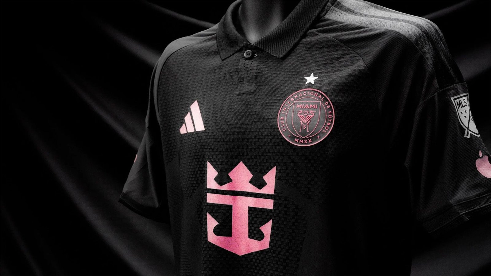 Inter Miami's 2026 away kit showcased in black with pink details, featuring the club's logo and crown emblem on the chest.
