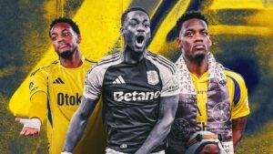 Jhon Durán, dressed in black goalkeeper kit, celebrates with a scarf and is flanked by two images of him in yellow kit, showcasing his journey.