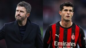Michael Carrick, in a black coat, gestures on the sideline; Christian Pulisic, in AC Milan's red and black striped kit, looks on.