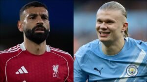 Mohamed Salah in Liverpool's red kit alongside Erling Haaland in Manchester City's sky blue, highlighting their rivalry in football.