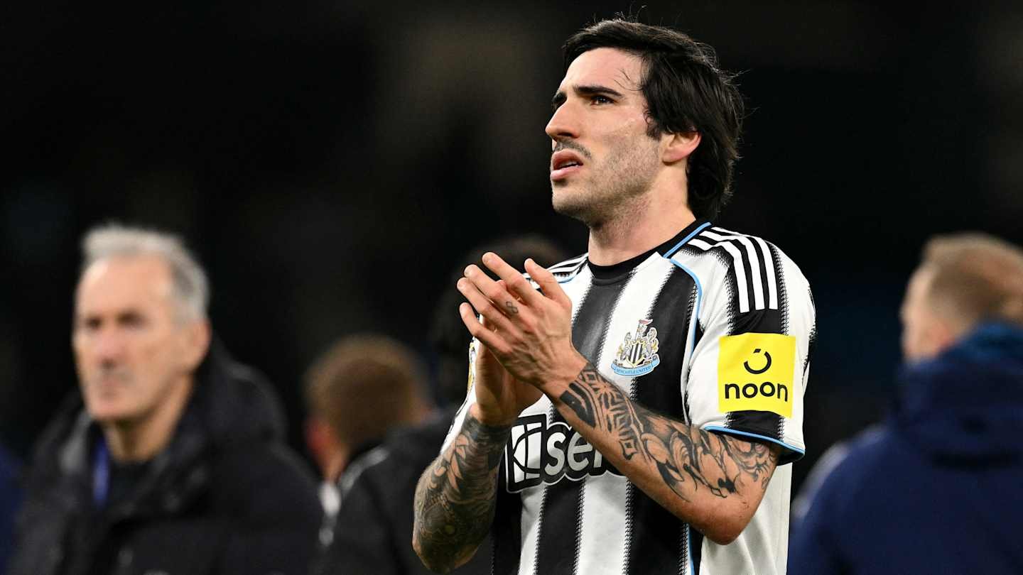 Sandro Tonali in a Newcastle United kit, applauding the fans, wearing the captain's armband in a stadium setting.