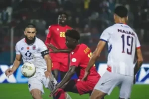 Action-packed moment during a match featuring AS FAR's #6 and a player in red, showcasing intense competition in Moroccan football.