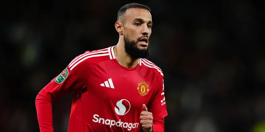 Munir El Haddadi in action for Manchester United, wearing a vibrant red kit with white stripes, during a match in the Carabao Cup.