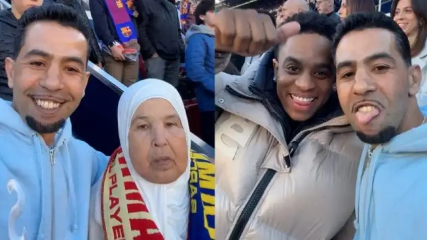 Two Moroccan fans at a football match, one wearing a Barcelona scarf, smiling and posing together with a woman in a headscarf.