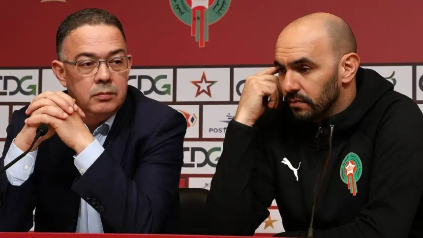 Moroccan FA president Fouzi Lekjaa and national team coach Walid Regragui during a press conference, discussing team strategies.