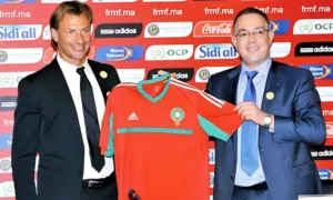 Hervé Renard and Moroccan Football Federation president present the national team's red jersey, symbolising a new chapter for Moroccan football.