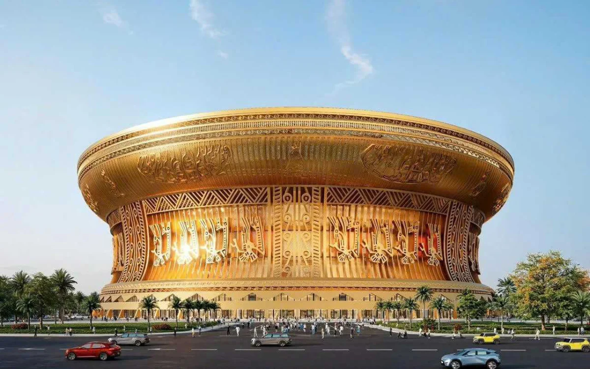 Golden-trimmed Trong Dong Stadium in Vietnam, showcasing its unique architectural design against a clear blue sky.